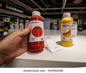 Paris, France - Jul 28, 2018: POV Personal Perspective Male Hand Shopping Inside Ikea Store For Delicious Food - Tomato Ketchup And Senap Mild Mustard With Th Price Of 1 75 Euros