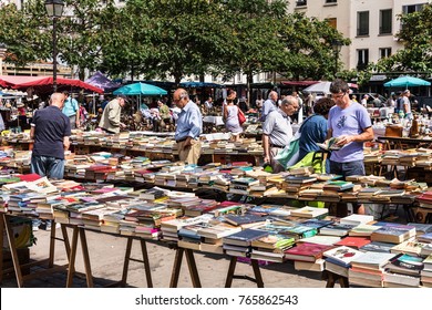 Paris, France - Jule 09, 2017: People Choosing Rare And Used Books At The Historic Flea Aligre Market (Marche D'Aligre) In The Bastille District.