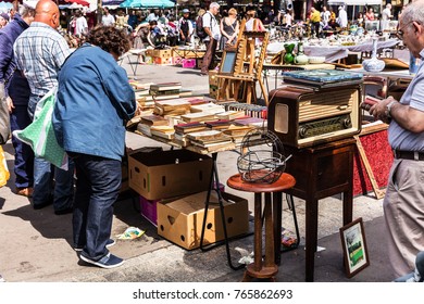 Paris, France - Jule 09, 2017: People Choosing Rare And Used Books, Vintage Goods At The Historic Flea Aligre Market (Marche D'Aligre) In The Bastille District.