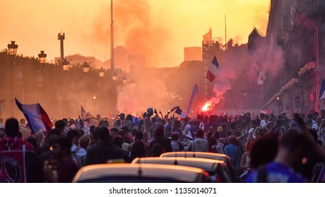 PARIS, France – July 15, 2018 : Thousands Of Jubilant French Fans On The Avenue Des Champs-Élysées Celebrating France's Victory Over Croatia In The 2018 FIFA World Cup Final.