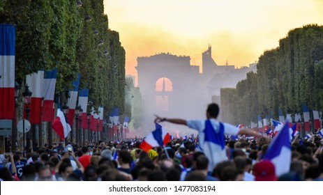 PARIS, France – July 15, 2018 : Thousands Of Jubilant French Fans On The Avenue Des Champs-Élysées Celebrating France's Victory Over Croatia In The 2018 FIFA World Cup Final.