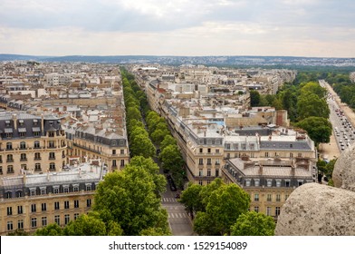 Paris, France - July 2019 - Panoramic View From The Top Of Arc De Triomphe Above Paris Roofs On Tree-bordered Avenue Victor Hugo And Avenue Foch, Widest Street Of Paris, Heading To Bois De Boulogne