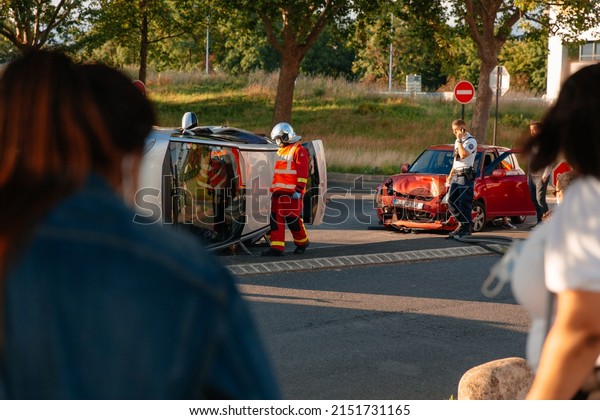 PARIS, FRANCE - July, 2021: Car crash accident,\
collision, vehicles damaged. French firemen intervention on road\
accident.