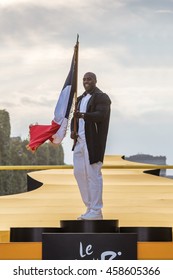 PARIS, FRANCE - JULY 24, 2016 : The French Judoka Athlete Teddy Riner Bearing The French Flag For Rio 2016 Olympics Games. 