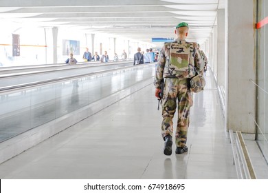 PARIS, FRANCE - JULY 3, 2017: Security Patrol Soldier Of National Armed Forces Of France At Charles De Gaulle Airport, Keeping Security After Recent Terrorist Attacks In Paris.