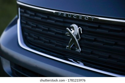 Paris, France - JULY 4, 2020: Peugeot car logo on a car grill. Space for text. Peugeot icon. Peugeot is a French cars brand, part of PSA Peugeot Citroen.