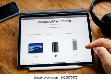 Paris, France - Jun 6, 2019: Man Reading On Apple IPad Pro Tablet About Latest Announcement Of At Apple Worldwide Developers Conference WWDC - Showing The Old Mac Pro, New One And MacBook Pro 15