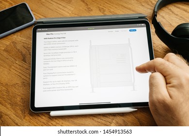 Paris, France - Jun 6, 2019: Man Reading On Apple IPad Pro Tablet About Latest Announcement Of At Developers Conference WWDC - Showing The Mac Pro Workstation With Amd Radeon Pro Vega II Duo