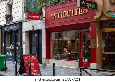Paris, France - June 02, 2022: Facade of an antique shop in Paris. red facade