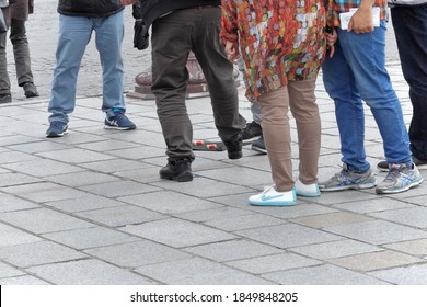 Paris / France - June 10, 2019: Con Artists Perform Illegal Shell Game, Confidence Trick Scam,  Performed With Matchboxes