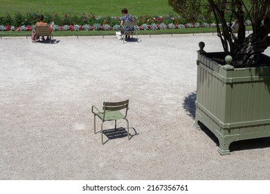 PARIS, FRANCE - June 14, 2022: Luxembourg Gardens in Paris. Garden chairs in Paris. Metal sun loungers for relaxing in the park