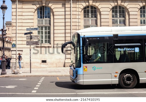 PARIS, FRANCE - JUNE 14, 2022: The bus\
goes along the city street. bus public\
transport