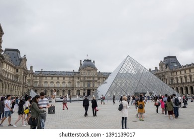 Paris, France, June 19 2018: Tourists In Louvre Courtyard