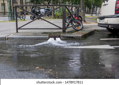 Paris, France, June 19 2018: Water Coming Out Of Sewer Drain