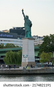 PARIS, FRANCE- JUNE 2, 2022: Statue of Liberty on the Ile aux Cygnes, River Seine in Paris. The grandest replica of all is just off the Grenelle Bridge on the  man-made island called Ile aux Cygnes.