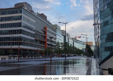 Paris, France - June 2020 - A Row Of Modern, Glass Office Buildings On Pierre Mendès-France Avenue, In Paris-Rive Gauche Business District ; The Weather Is Rainy And The Asphalt Of The Road Is Wet