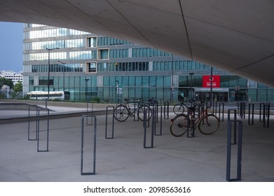 Paris, France - June 2021 - Bike Parking With Ring-shaped Locking Polesunder The Arch Of Le Monde Group Headquarters, On Pierre Mendès-France Avenue, In The Business District Of Paris Rive Gauche