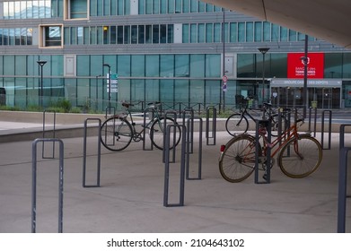 Paris, France - June 2021 - Bike Parking With Ring-shaped Locking Polesunder The Arch Of Le Monde Group Headquarters, On Pierre Mendès-France Avenue, In The Business District Of Paris Rive Gauche