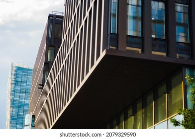 Paris, France - June 2021 - Detail In Low Angle View Of A Wood-colored, Cantilever Wing Of A Modern Glass Office Buildings In Paris-Rive Gauche Business District, On Pierre Mendès-France Avenue