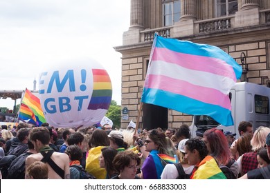 PARIS, FRANCE - JUNE 24, 2017: Trans Flag Floats Above The Crowd At The Gay Pride.
