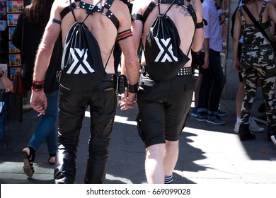 PARIS, FRANCE - JUNE 24, 2017:  Gay Couple Hold Hands At The Gay Pride Parade.
