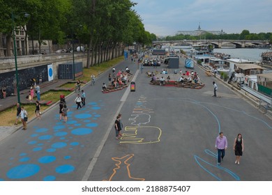 Paris, France - June 27, 2015: Wide, Overhead Shot Of People Hanging Out And Enjoying The Art Installations Along The Seine River. Beautiful Summer Day Outdoor In The Chic City Of Paris, France.