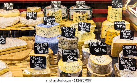 Paris, France - June 29, 2017:  A Large Selection Of Different French And Italian Cheeses On The Counter Of A Small Store At The Aligre Market (Marche D'Aligre) In The Bastille District.