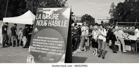 PARIS, FRANCE - JUNE 4, 2017: Promotion of natural textile at BiodiversiTerre event (created by Gad Weil) showing relationship of mankind with nature in today's society. Triumph Arch at background.