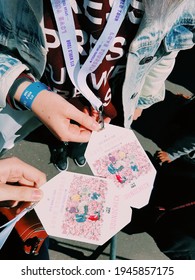 Paris, France - June 8, 2019: Two Friends Holding BTS World Tour Love Yourself Speak Yourself Soundcheck VIP Badges Near The Concert Stadium