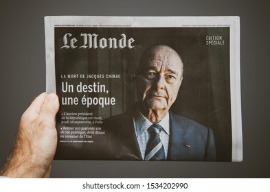 Paris, France - Man Hand Holding Le Monde French Newspaper Special Edition With Jacques Chirac Former French President On The Cover