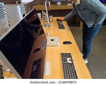 Paris, France - Mar 18, 2022: Young Man Customer Looking At The New Studio Display And Mac Studio M1 Ultra During The Sales Launch At The Apple Inc. Flagship Store Of New Apple SE 3 Smartphone, IPad