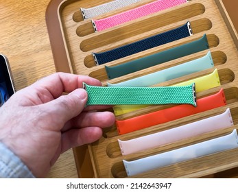 Paris, France - Mar 18, 2022: POV Personal Perspective Male Hand Looking At The Apple Watch Braided Green Solo Loop Reflective Band