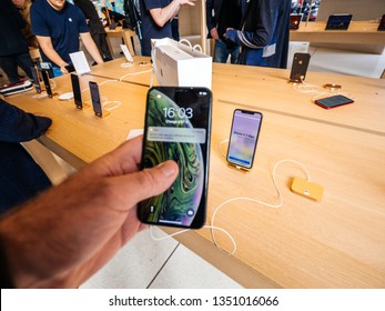 Paris, France - Mar 19 2019: Shopping Atmosphere In Apple Store With Man POV Personal Perspective Holding IPhone XS Inside The New Store Champs-Elysees Largest French Store Located In The Heart Of The