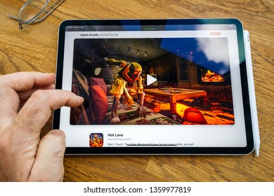 Paris, France - Mar 27, 2019: POV Personal Perspective On Apple Arcade Webpage Seen On Modern IPad Pro Tablet Featuring The New Subscription Showing Hot Lava By Klei Entertainment