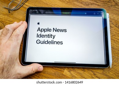 Paris, France - Mar 27, 2019: POV Personal Perspective On Apple News Webpage Seen On Modern IPad Pro Tablet Featuring Identity Guidelines