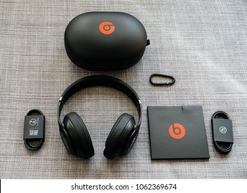 PARIS, FRANCE - MAR 31, 2018: View from above of new Beats 3 Studio professional wireless headphones made by Beats by Dr Dre Apple with all the accesories - unboxing process 