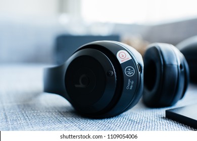 PARIS, FRANCE - MAR 31, 2018: View from above of new Beats 3 Studio professional wireless headphones made by Beats by Dr Dre Apple charge me up sticker