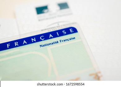 Paris, France - Mar 31, 2019: Tilt Shift lens close-up macro shot of National identity card Carte nationale d identite with focus on French nationality text