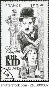 PARIS, FRANCE - MARCH 01, 2021: A stamp printed in France shows portrait of Charlie Chaplin (1889-1977), series Celebrate the Century of The kid, 1921, 2021