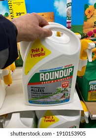 Paris, France - March 05, 2020 : Customer Buying Roundup In A French Hypermarket. The New Roundup Is A Brand-name Of An Herbicide Without Glyphosate, Made By Monsanto Company.