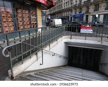 Paris, France - March 14th 2021: Some Chairs Piled Up At A Closed Restaurant During The Coronavirus Pandemic. A Parisian Cafe Located Near An Access To The Metro Station Gare De Lyon.