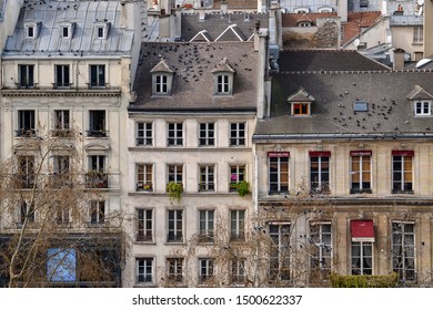 PARIS, FRANCE - MARCH 19, 2014: view of typical parisian building facades taken from the Pompidou Centre in the Beaubourg area of the 4th arrondissement of Paris.
