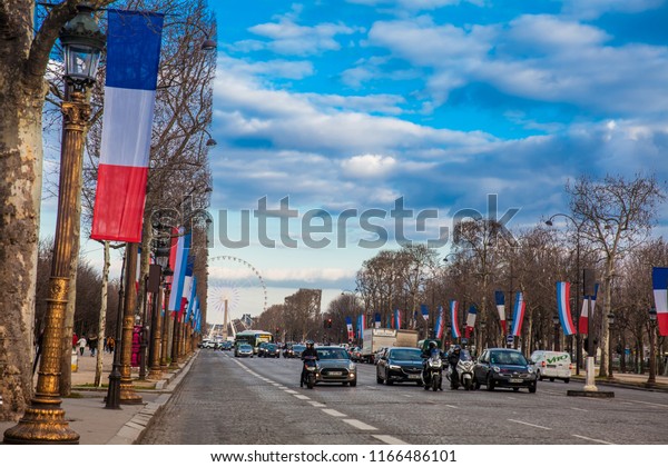 PARIS, FRANCE - MARCH, 2018:\
Champs Elysees and the Wheel of Paris in a cold winter day in\
Paris