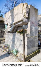 Paris, France - March 23, 2015: In the Pere Lachaise Cemetery in Paris sits the Mausoleum of the writer Oscar Wilde on a sunny day. Now protected by glass.