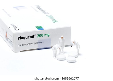 Paris, France - March 24 2020 : Box Of Plaquenil ,figurines Looking Chloroquine Pills