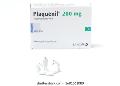 Paris, France - March 24 2020 : Box Of Plaquenil ,figurines Looking Chloroquine Pills