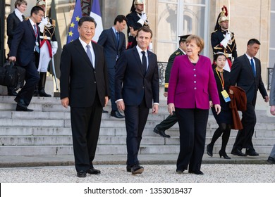 PARIS, FRANCE - MARCH 25, 2018 : Emmanuel Macron, Angela Merkel and Xi Jinping  walking  in the courtyard of Elysee Palace during the state visite of the chinese President in France.