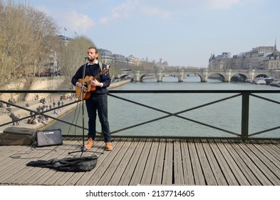 Paris, France - March 5, 2022: Street Guitarist At Bridge Of The Arts In Paris, France.