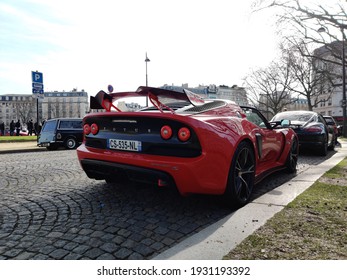 Paris, France - March 6th 2021: Red Lotus Exige S on a cobble stone old road