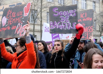 PARIS, FRANCE - MARCH 8, 2020 : Demonstration on International Women’s Day. Young woman with a black eye and placard to protest alarming femicide levels.